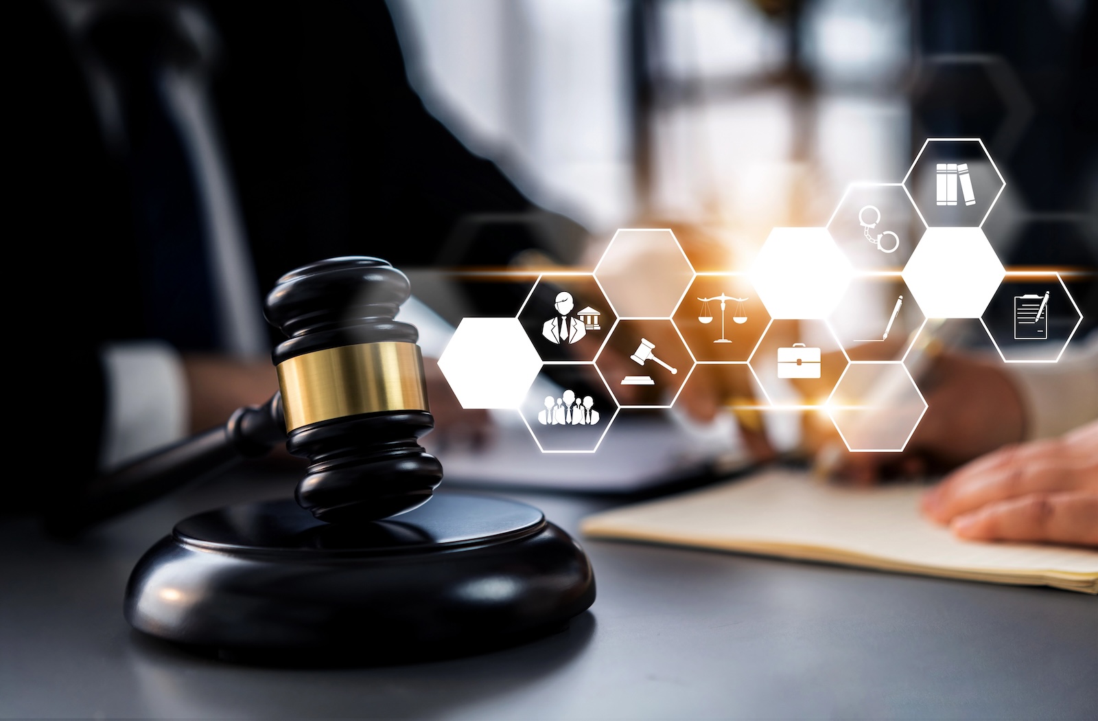 Legal icons with a judges gavel and lawyers in the background